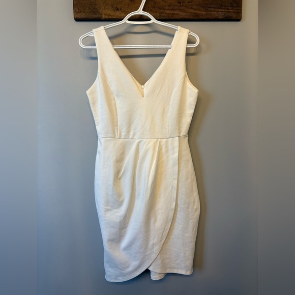 White Asymmetrical Mini Dress with a deep v neckline in size Medium - Picture 4 of 8